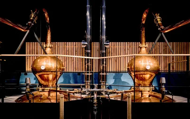 Hand-hammered Charentais copper pot stills in the Maison Lineti still room.